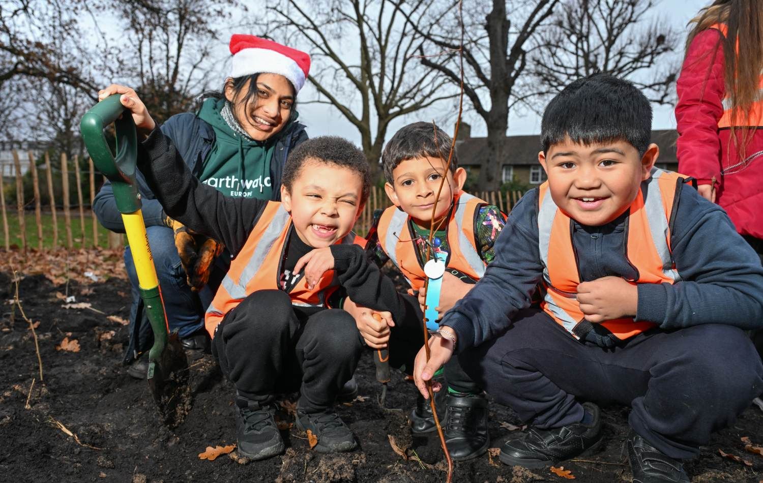 Wormholt Park Tiny Forest: school children planting trees