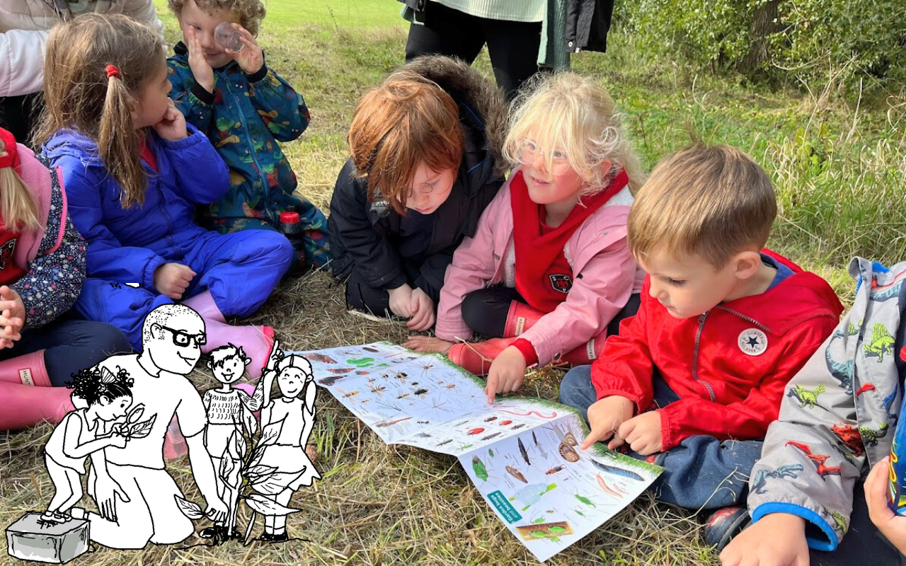 Action for community: curious schoolchildren looking at wildlife ID sheets in Tiny Forest